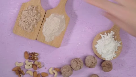 Alternative nut flour. Vegan baking. Almond, walnut, cashew flour. Flat lay Stock Footage 171713110