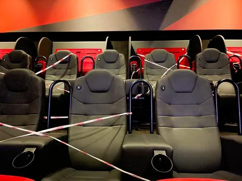Alternative seating marks for social distancing at the cinema . Stock Photos