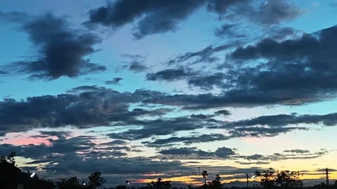 Alternative view of dramatic sky at sunset with pink twilight clouds. Stock Footage 347457171