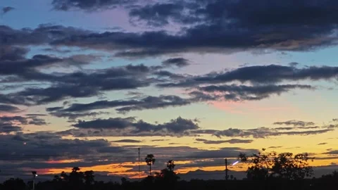 Alternative view of dramatic sky at sunset with golden horizon and pink clouds. 스톡 동영상 347487906