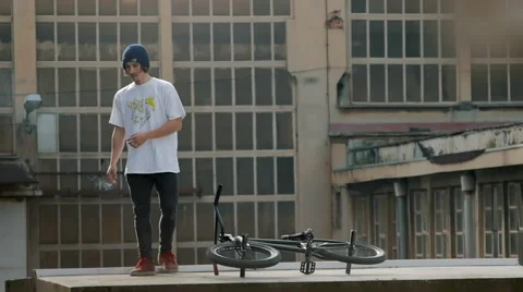 Alternative young adoult on a rooftop Stock Footage 57350491