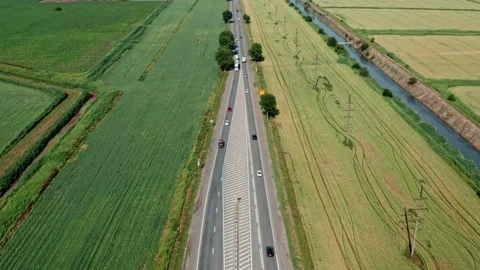Altitude view of the highway among the fields Stock Footage 197386601