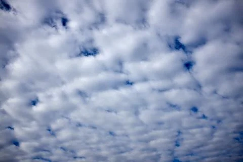 Altocumulus cloud formation in a blue sky Stock Photos