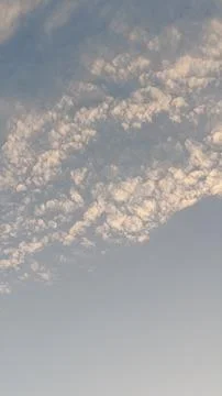 Altocumulus cloud formations in blue sky with sunlight texture Photos