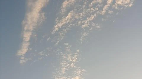 Altocumulus cloud formations in blue sky with sunlight texture Stock Photos