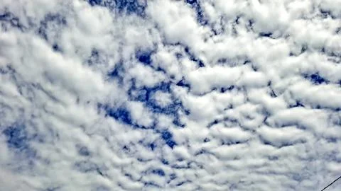 Altocumulus Cloud Pattern on Bright Blue Sky Stock Photos