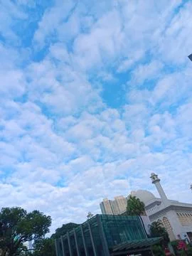 Altocumulus clouds over minarets Stock Photos