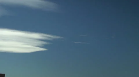 Altocumulus Lenticularis with Contrails Stock Footage 54723115