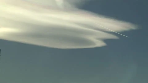 Altocumulus Lenticularis with Contrails Stock Footage 54723136