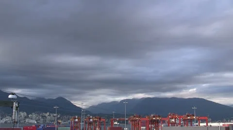 ALTOSTRATUS TIME LAPSE CLOUDS CONTAINER YARD MOUNTAINS Video stock 25100159