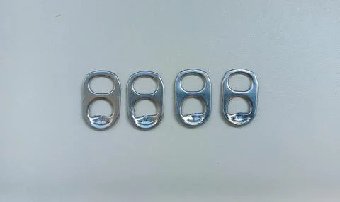 Aluminum Can Pull Tabs in a Row Stock Photos