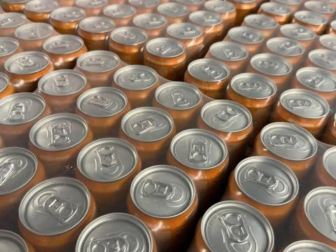 Aluminum cans arranged in rows, captured from above for packaging background Stock Photos