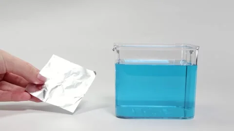 Aluminum Foil Float and Sink Science Experiment Stock Footage 309272068