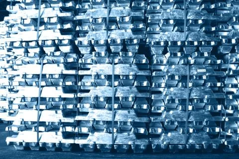 Aluminum ingot bar stack in warehouse for supplying to factory. 写真素材