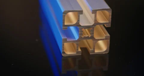 Aluminum profile cross section in blue and warm light on black background Stock Footage 331448613
