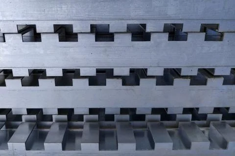 The aluminum profile with rectangular teeth along the entire length is folded 写真素材
