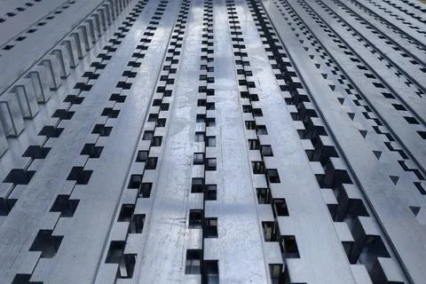 The aluminum profile with rectangular teeth along the entire length is folded Stock Photos