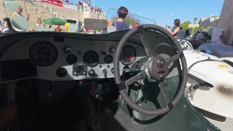 Alvis cockpit dashboard paddock slow motion push-in, Malta Classic 2025 in Stock Footage 323149990
