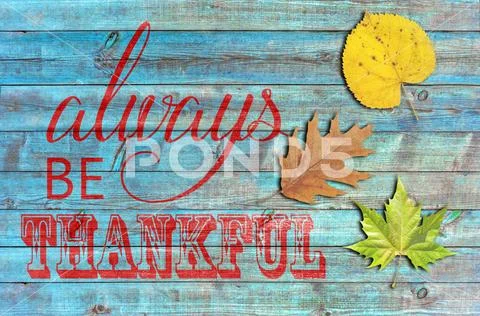Always be thankful on blue wooden background Stock Photos