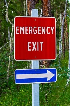 Am angled view of an emergency exit sign Stock Photos