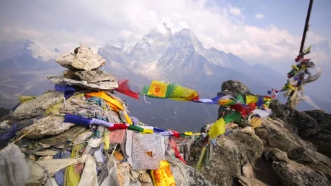 Ama Dablam mountain. Colourful prayer flags are waving on wind. Himalaya, Nepal Stock Footage 70475667