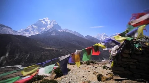 Ama Dablam mountain in Dingboche valley. Waving prayer flags. Himalaya, Nepal Stock Footage 70475612