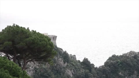 Amalfi coast building on cliff mountain shot from moving vehicle Stock Footage 252149331