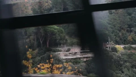 Amalfi coast mountain shot from moving driving vehicle across from it with pan Stock Footage 252150151