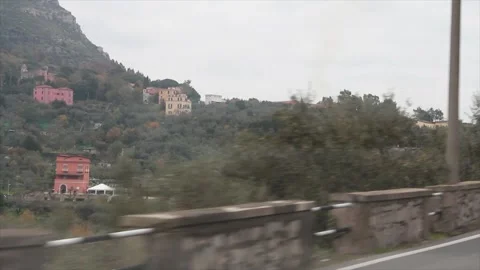 Amalfi coast mountain tip covered in with trees and some homes houses buildings Stock Footage 252148776