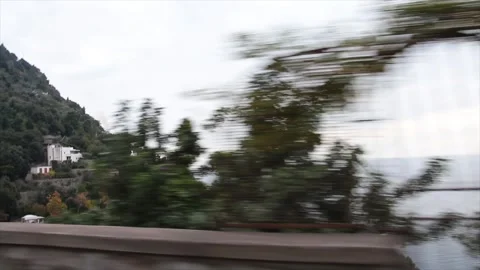 Amalfi coast mountain with trees and some homes houses buildings shot from car Stock Footage 252149085