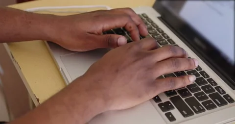 Aman typing on a computer Stock Footage 184879181
