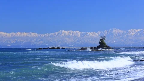 Amanoharako Beach and the Tateyama Mountain Range Stock Footage 332001153
