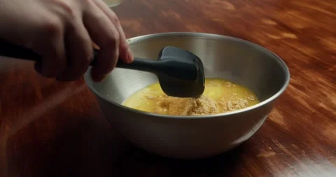 Amaretti in a plastic bag being crushed with a rolling pin. Видео 330134129