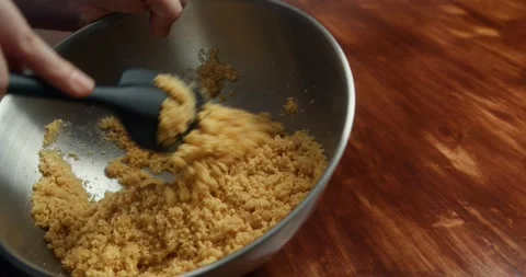 Amaretti in a plastic bag being crushed with a rolling pin. Vídeos de archivo 330134137