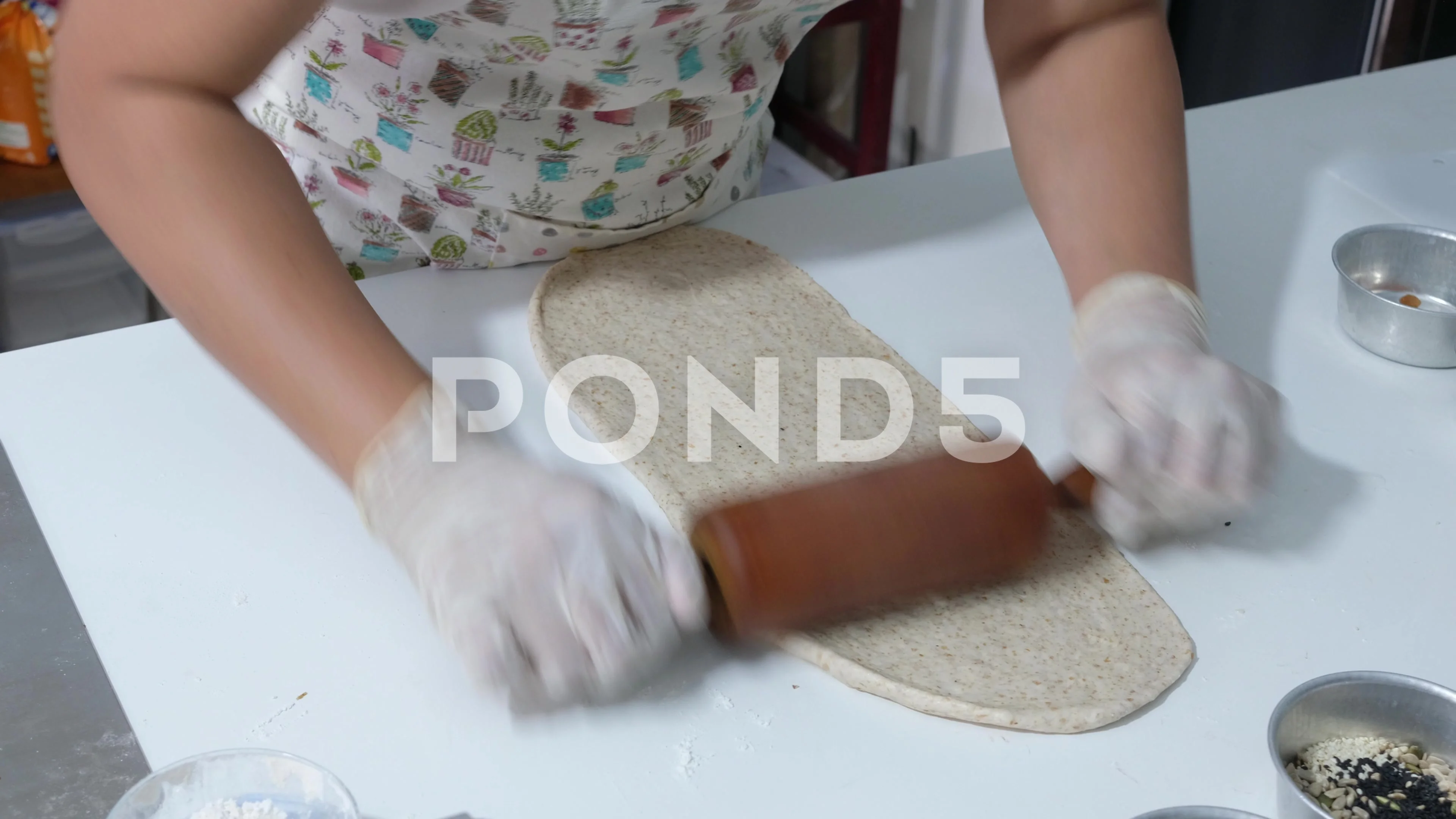 An amateur housewife rolling the bread d... | Stock Video | Pond5