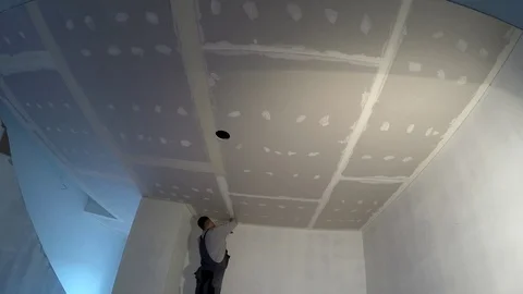 Amateur worker apply plaster on ceiling joints. Do it yourself timelapse 스톡 동영상 119513887