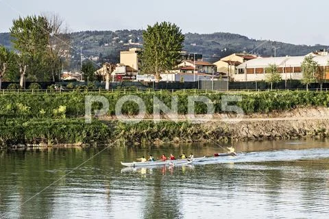 Amateurs team of rowing on the Arno river Stock Photos