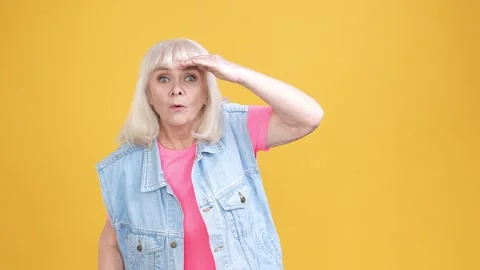 Amazed aged lady point empty space cool promo isolated shine color background Stock Footage 189785095