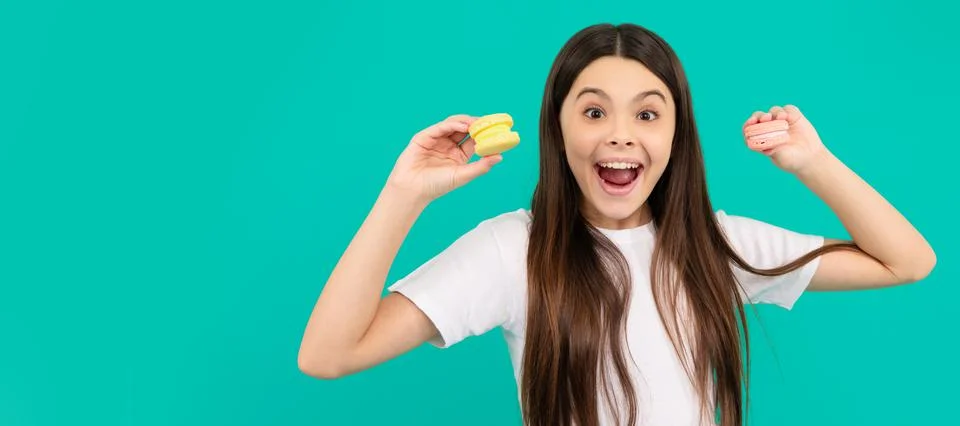 Amazed child hold french macaron or macaroon cookies, sweet tooth. Teenager Stock Photos