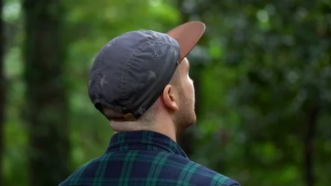 Amazed Facial Expression of Young Man Looking Around in Nature Setting Slow Stock Footage 105059077