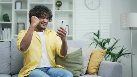 Amazed handsome man receiving sms message offer opportunity arabian happy man  Stock Footage 235504859