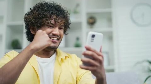 Amazed handsome man receiving sms message offer opportunity arabian happy man  Stock Footage 235504900