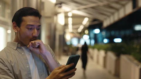 Amazed Happy Guy Receiving SMS Message Reading Good News About Winning Money Stock Footage 275815156