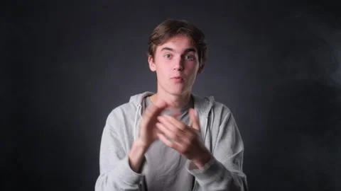 Amazed Man Applauding on black Background Stock Footage 257470926