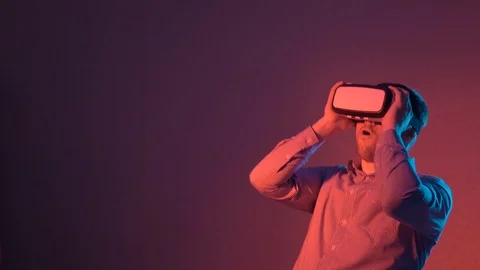 Amazed man using VR glasses Stock Footage 101753863