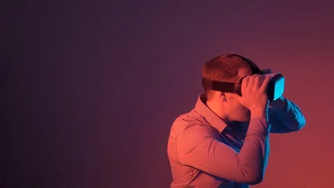 Amazed man using VR glasses Stock Footage 101753938