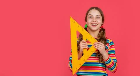 Amazed school child hold math tool of triangle Stock Photos