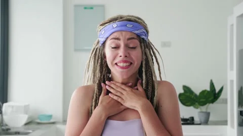 Amazed shocked with dreadlocks saying WOW. Preatty woman with stylish hairdo Видео 220108794
