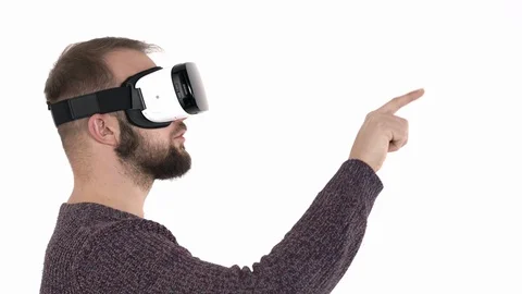 Amazed young man using virtual reality glasses. Shocked caucasian man wearing VR Stock Footage 121194264