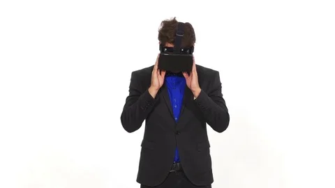Amazed young man wearing virtual reality glasses Stock Footage 71441206